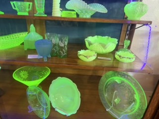 Uranium glass glowing under UV light