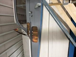 The Valhalla nameplate on the wooden boat
