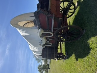 Reconstructed wagon with visible trail equipment