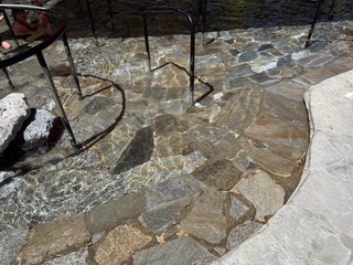 Beautiful rock slabs at the bottom of the hot springs pool